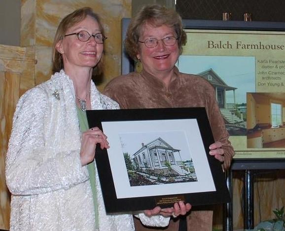 Karla (on left) receives award from Joanne Carlson, President, Bosco-Milligan Foundation